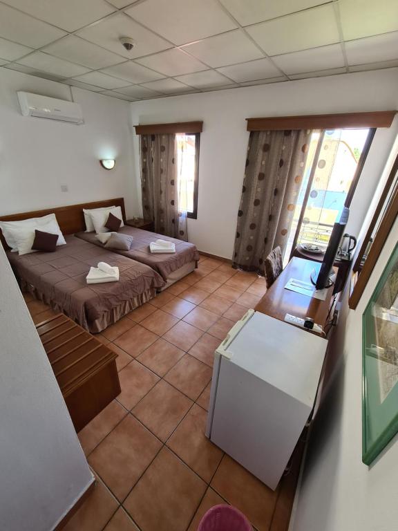 Postel nebo postele na pokoji v ubytování Metropole Hotel