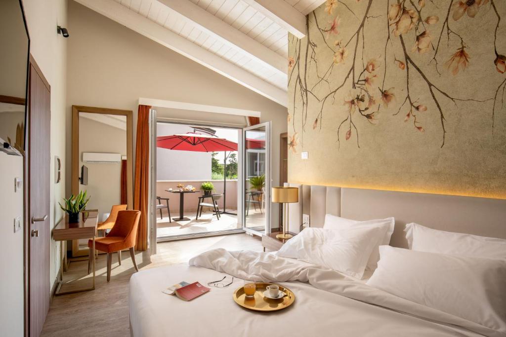Postel nebo postele na pokoji v ubytování Hotel Della Piana