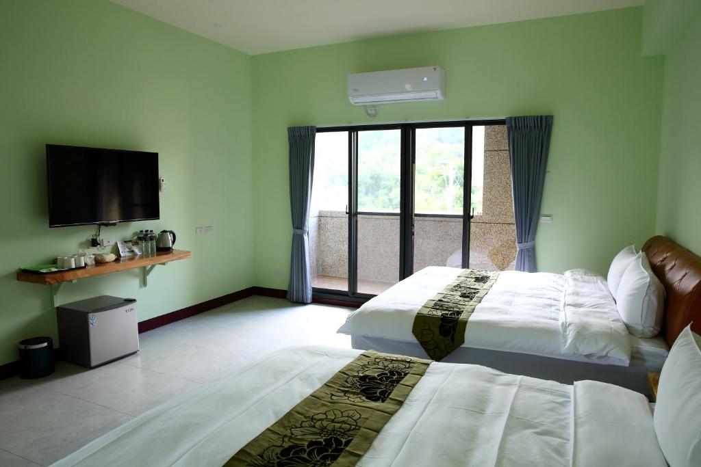 Postel nebo postele na pokoji v ubytování Yuan Homestay