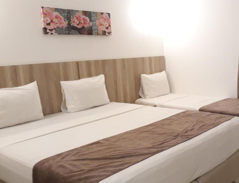 Postel nebo postele na pokoji v ubytování Pena Branca Hotel e Eventos
