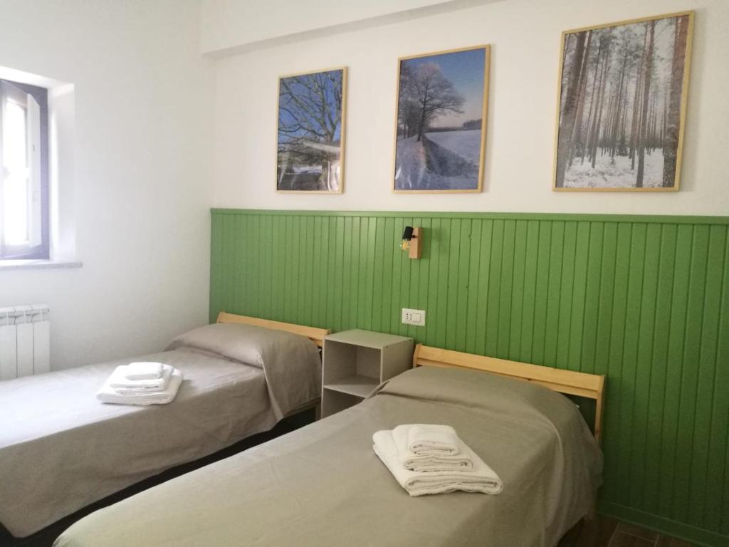 Postel nebo postele na pokoji v ubytování Ai Cerri di Remí