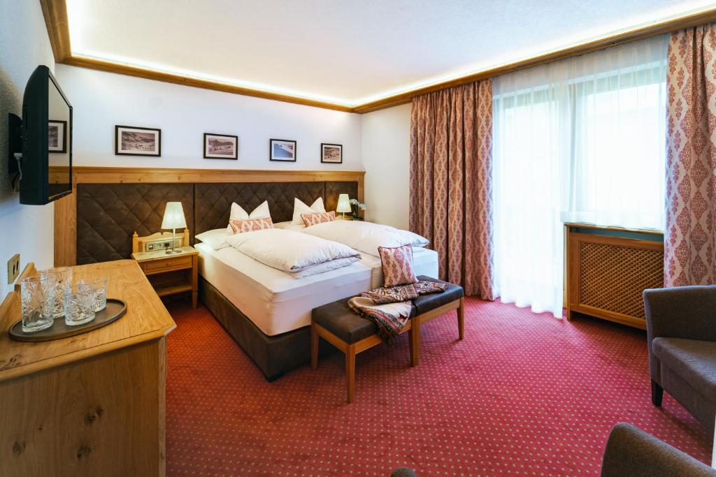 Postel nebo postele na pokoji v ubytování Hotel Ulli