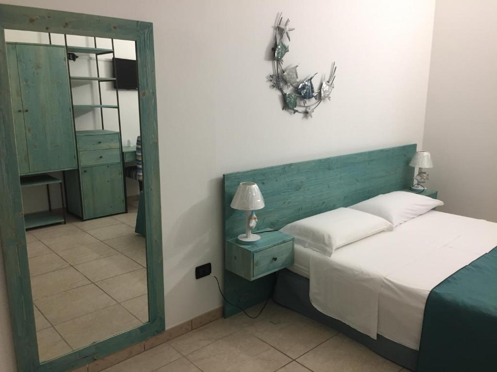 Postel nebo postele na pokoji v ubytování Hotel Universo