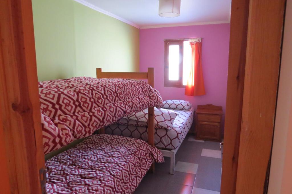 Postel nebo postele na pokoji v ubytování Ankatu Hostel