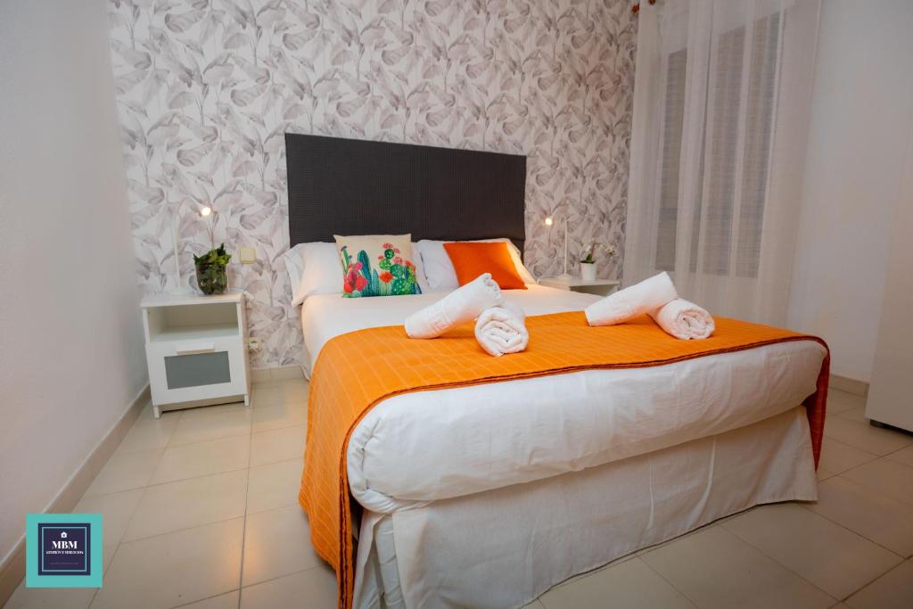 Posteľ alebo postele v izbe v ubytovaní Maria Rosa Urban & Beach Apartment