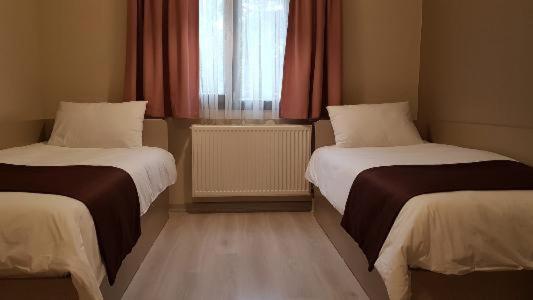Postel nebo postele na pokoji v ubytování Moda Hotel
