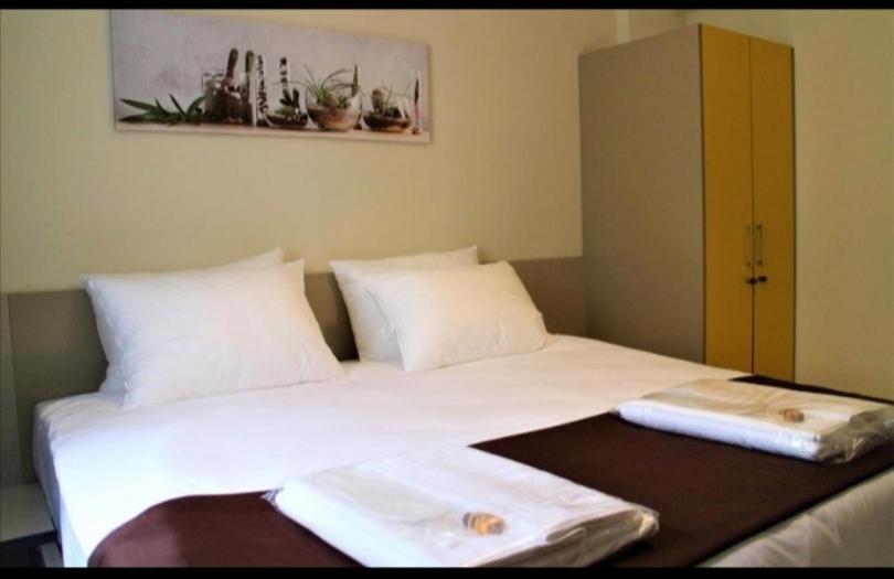Postel nebo postele na pokoji v ubytování Moda Hotel