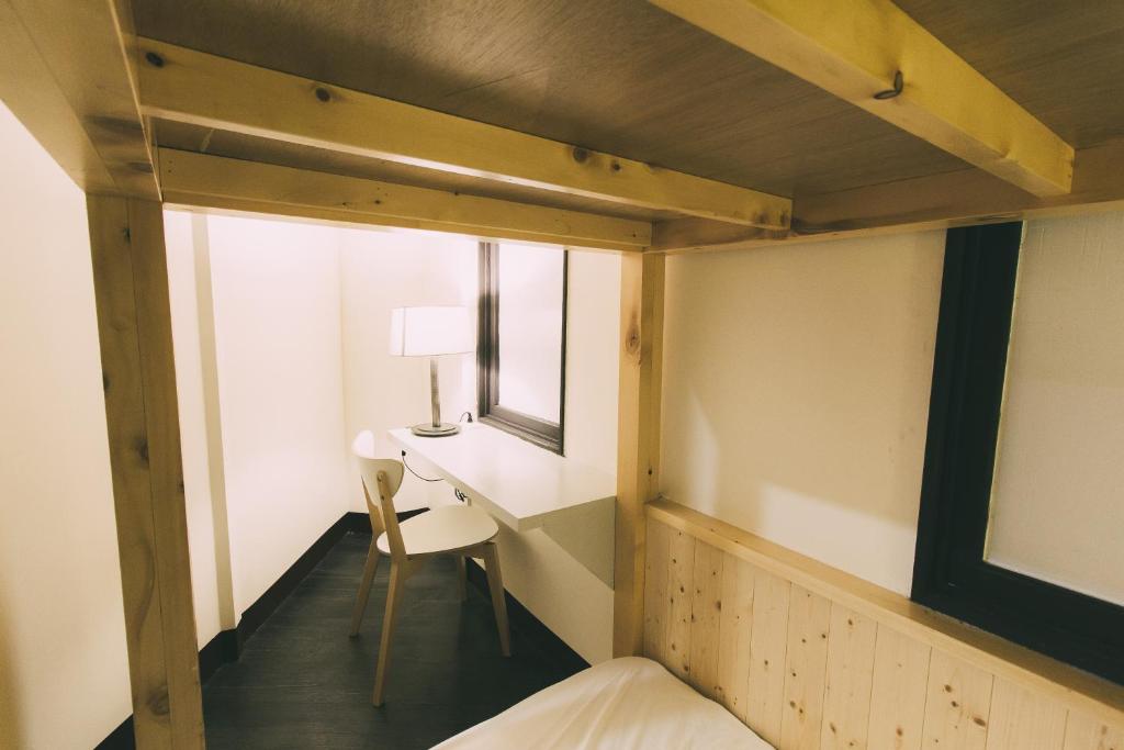 Postel nebo postele na pokoji v ubytování 阿信輕旅