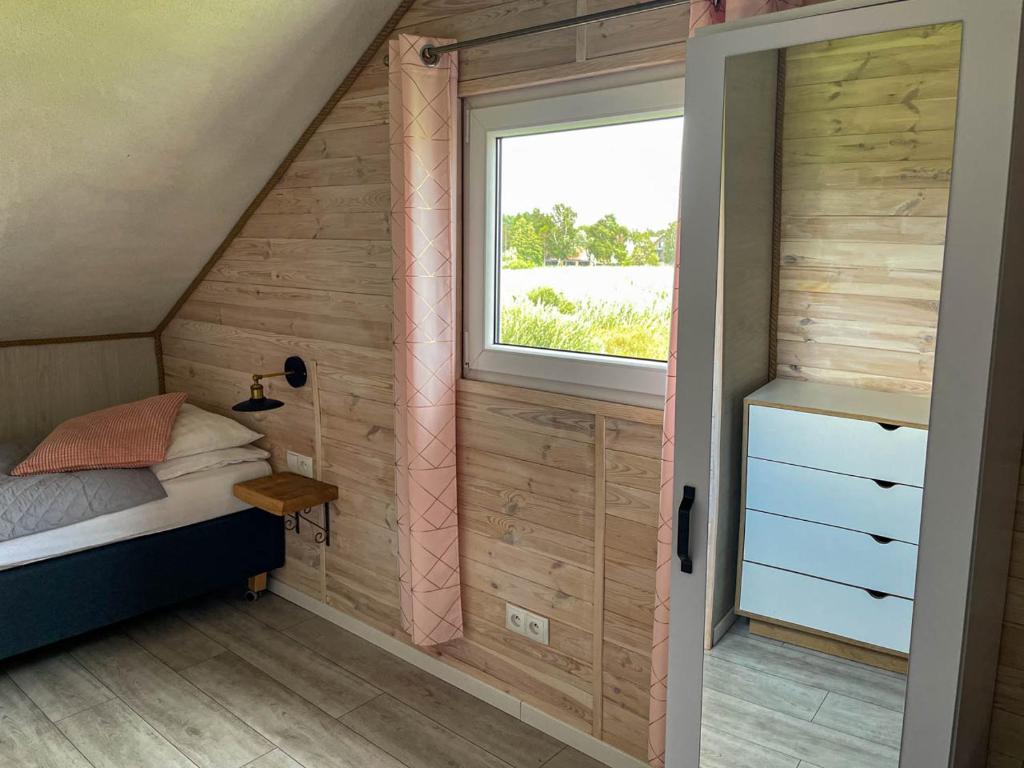 Posteľ alebo postele v izbe v ubytovaní Magic Home Łeba