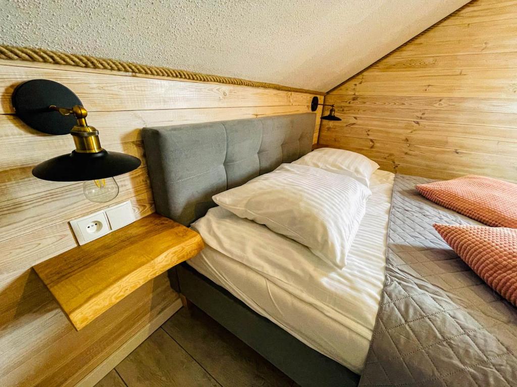 Posteľ alebo postele v izbe v ubytovaní Magic Home Łeba