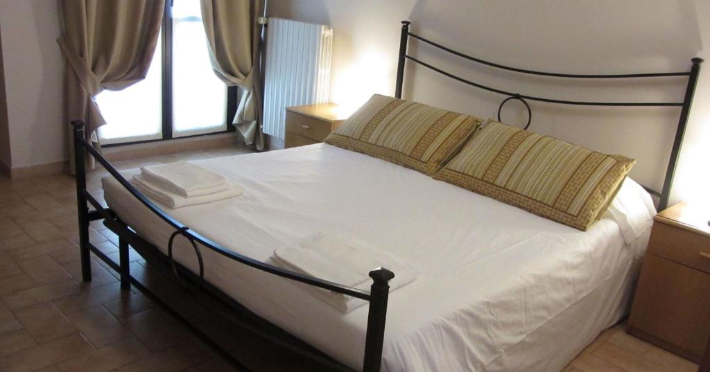 Postel nebo postele na pokoji v ubytování Villa Lomellini