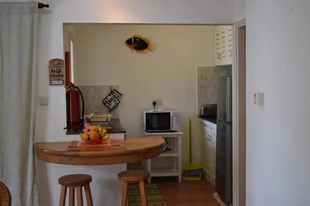 Kuchyň nebo kuchyňský kout v ubytování Sunbird Bungalow