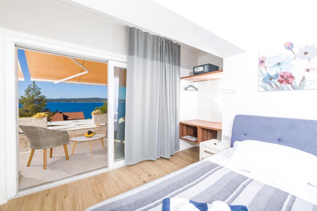 Postel nebo postele na pokoji v ubytování Stella Mare Eco Boutique House