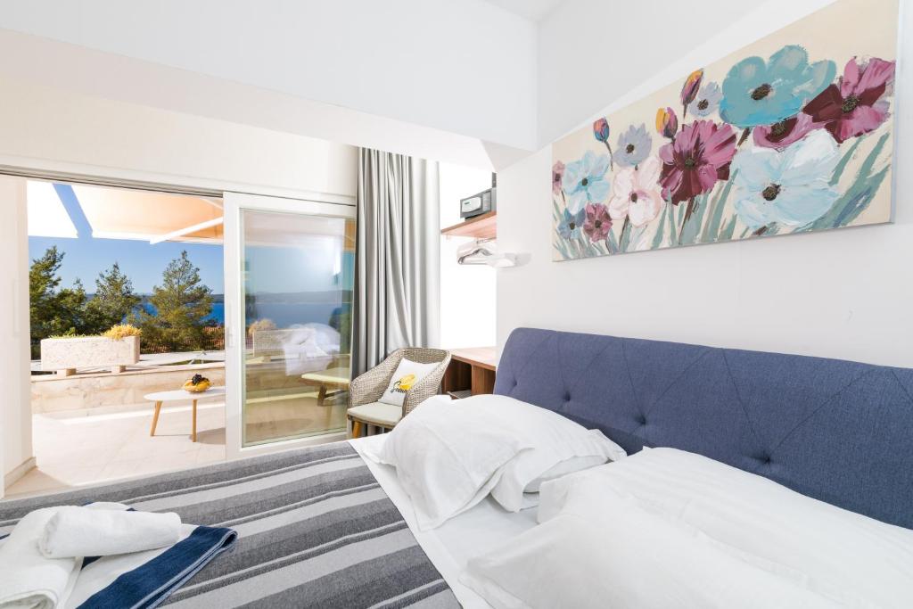 Postel nebo postele na pokoji v ubytování Stella Mare Eco Boutique House