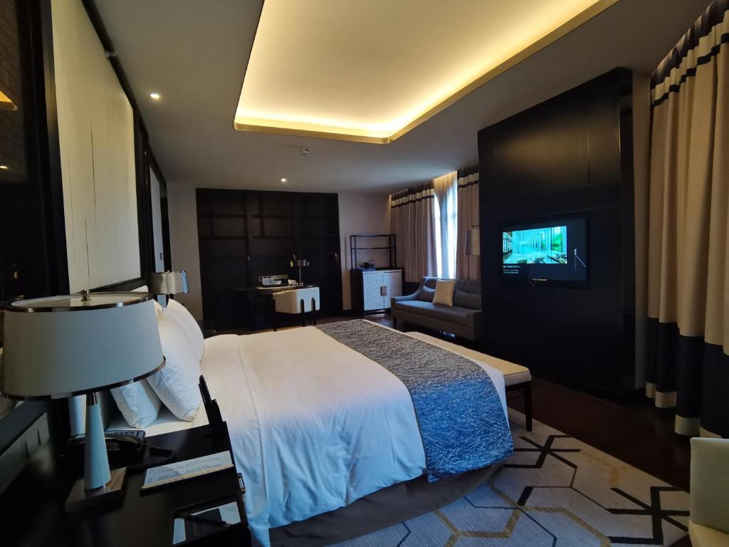 Postel nebo postele na pokoji v ubytování PRIMUS Hotel Wuhan Hannan
