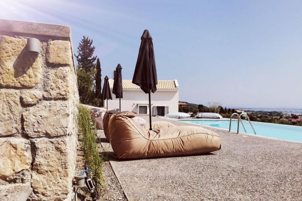 a large inflatable pillow sitting next to a swimming pool at LAURA_SEA VIEW_APARTMENT 2 in Lygia