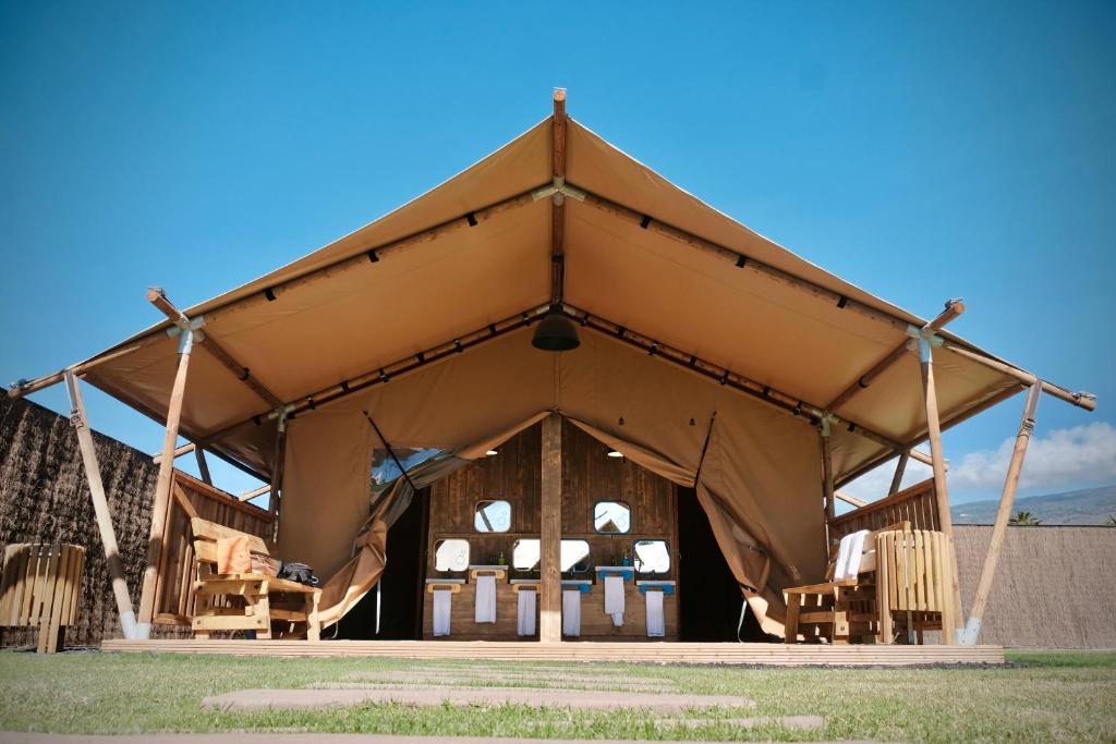a large tent with chairs in front of it at Las Terrazas de Abama Suites in Guía de Isora