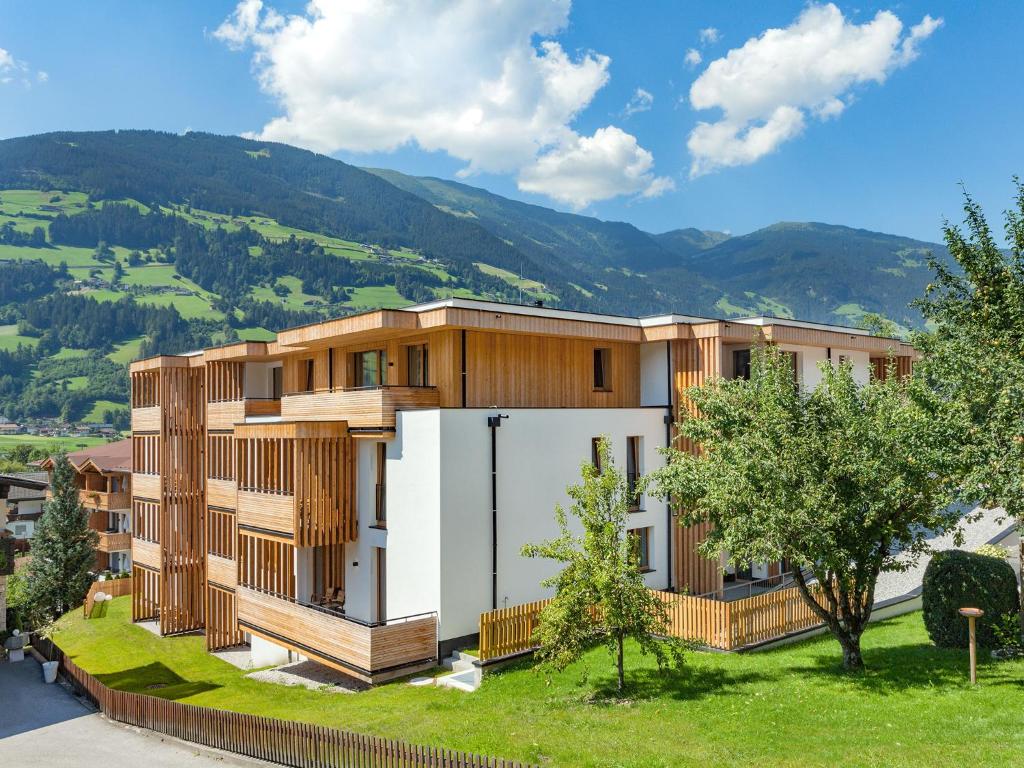 an architectural rendering of a building with wood panels at Alpin Apartments in Mayrhofen
