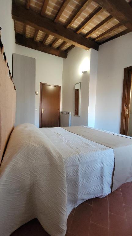 Postel nebo postele na pokoji v ubytování Locanda Francescana