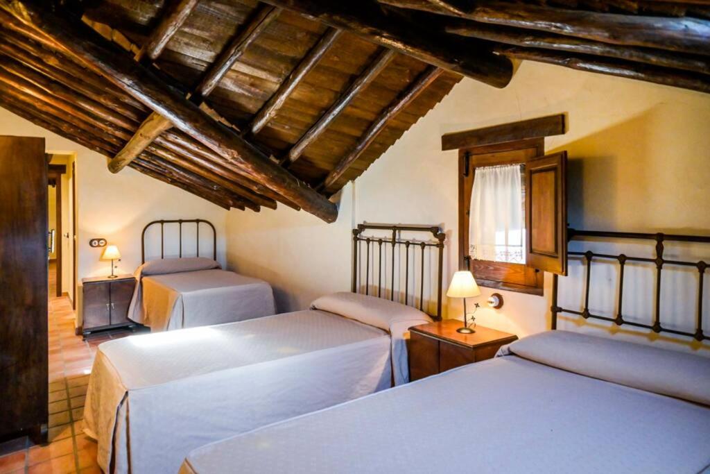 A bed or beds in a room at Un espacio único, 'La Casona del Señor' con bodega
