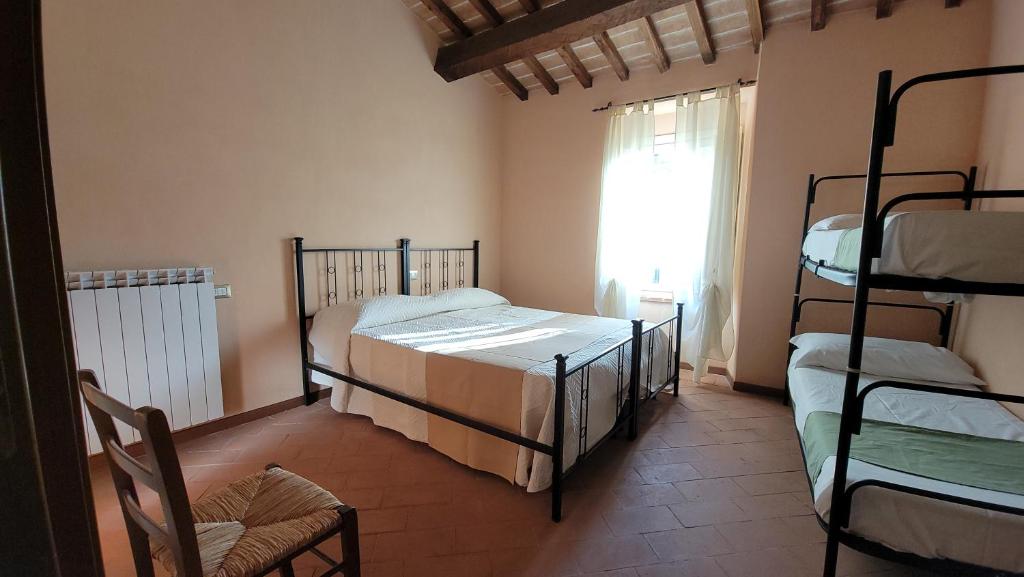 Postel nebo postele na pokoji v ubytování Locanda Francescana