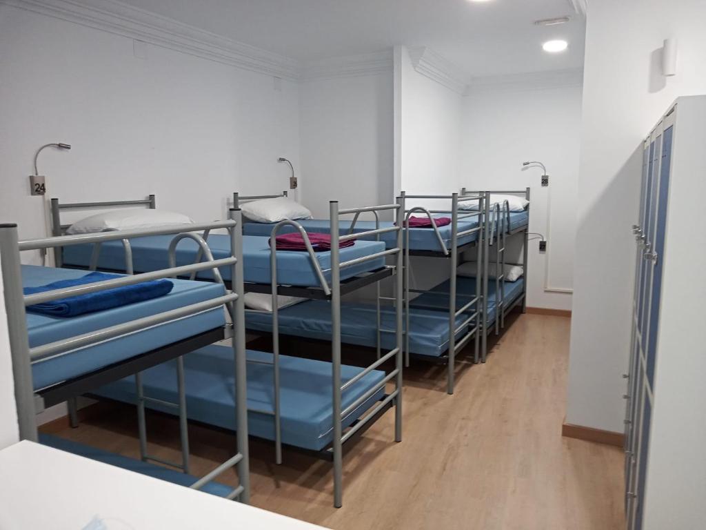 Postel nebo postele na pokoji v ubytování A Fonte De Compostela