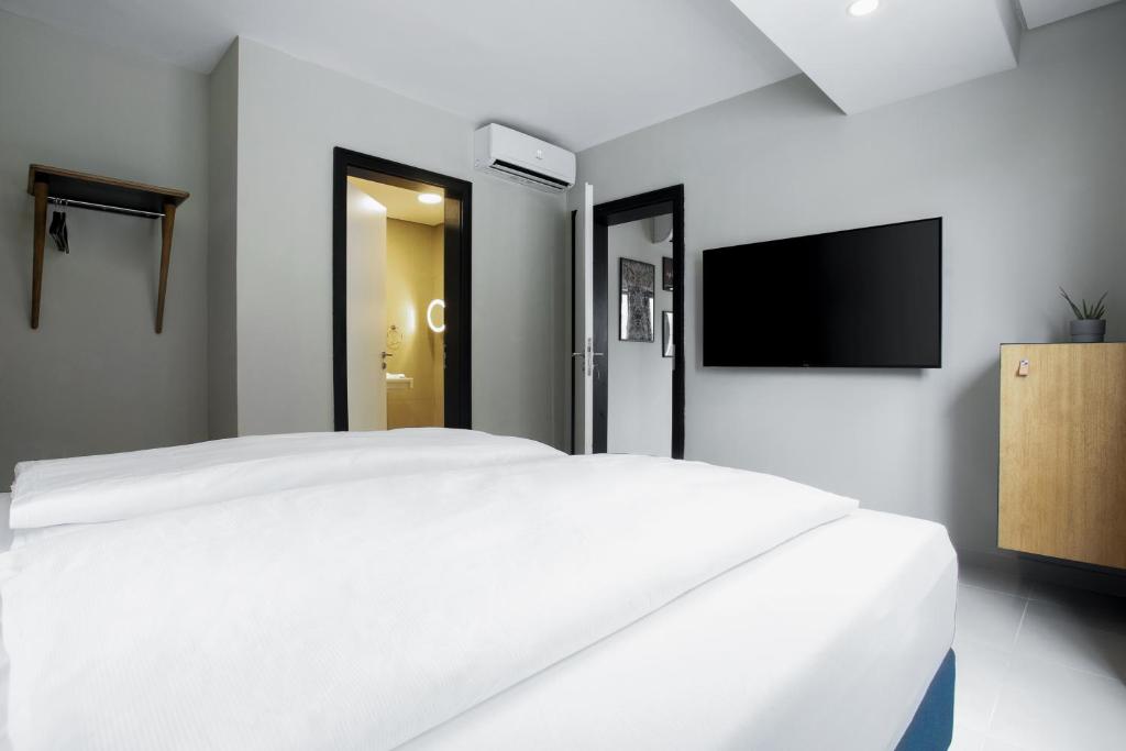 Sjónvarps- og/eða afþreyingartæki á Nordic Hotel Lagos