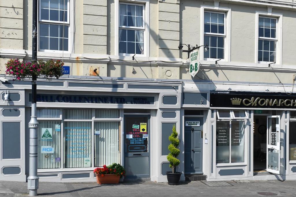 a store front of a building on a city street at Railway House Guest House in Mullingar