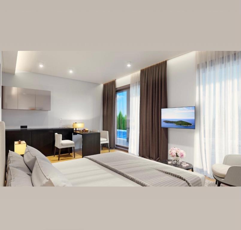 1 dormitorio con 1 cama y sala de estar en Sea Breeze White Villas, en Bilgah