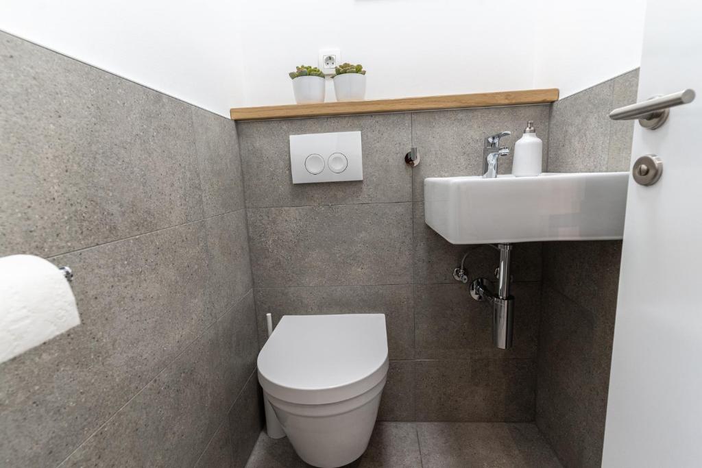 Koupelna v ubytování Apartmani Bilonic Rogoznica