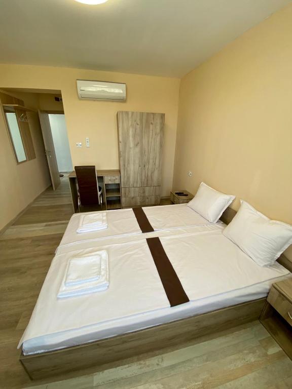 Postel nebo postele na pokoji v ubytování Hotel Sunrise