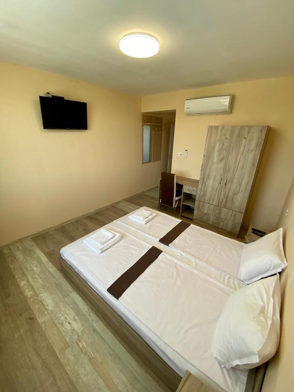 Postel nebo postele na pokoji v ubytování Hotel Sunrise