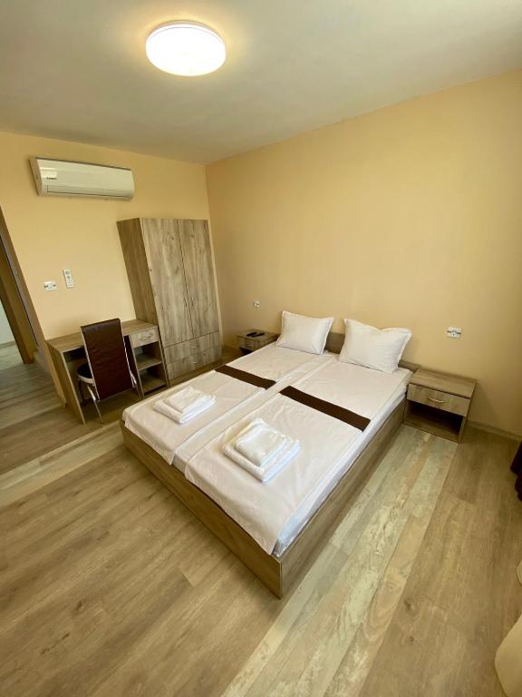 Postel nebo postele na pokoji v ubytování Hotel Sunrise