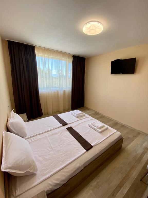 Postel nebo postele na pokoji v ubytování Hotel Sunrise