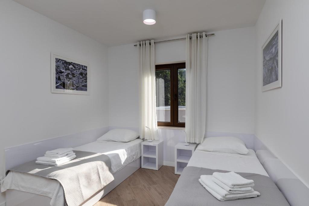 Posteľ alebo postele v izbe v ubytovaní Apartments Setemana