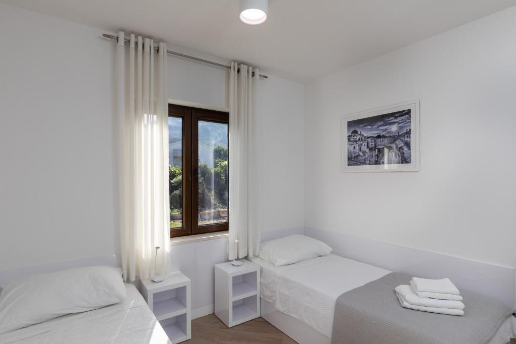 Posteľ alebo postele v izbe v ubytovaní Apartments Setemana