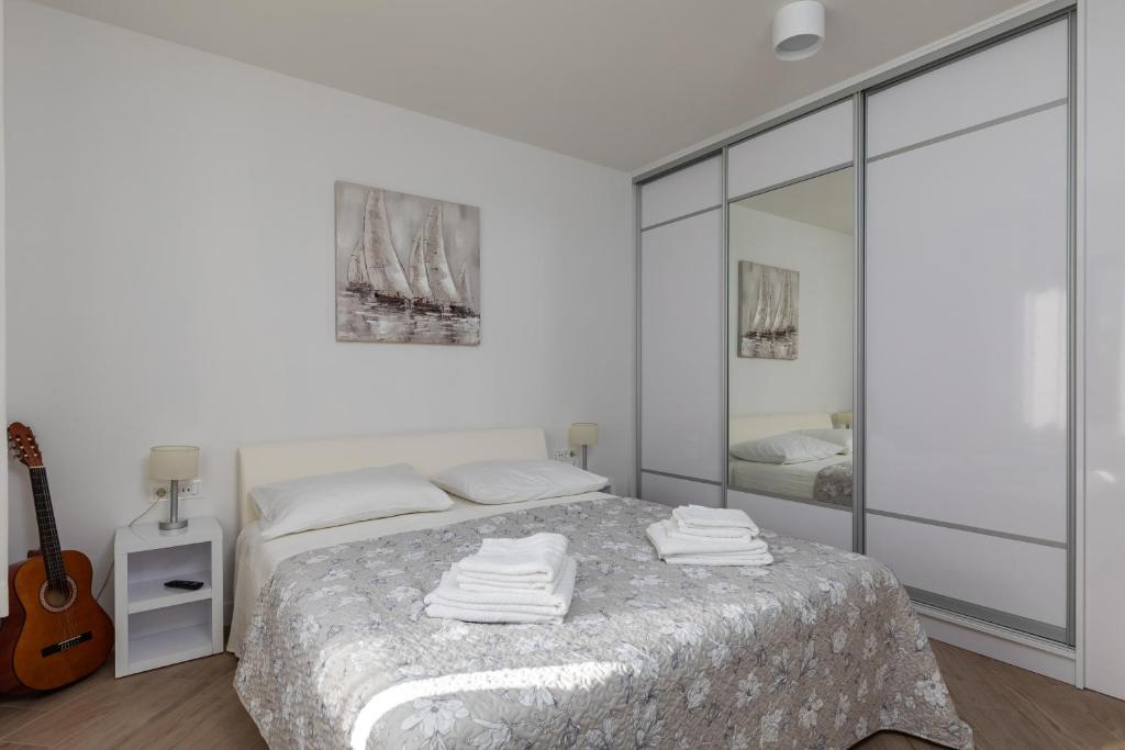 Posteľ alebo postele v izbe v ubytovaní Apartments Setemana
