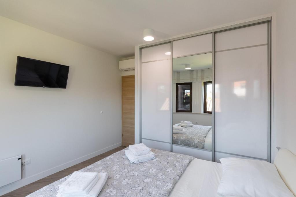 Posteľ alebo postele v izbe v ubytovaní Apartments Setemana
