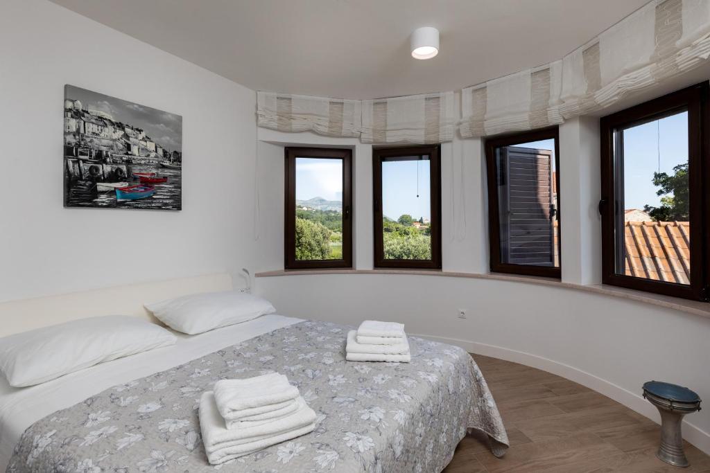 Posteľ alebo postele v izbe v ubytovaní Apartments Setemana