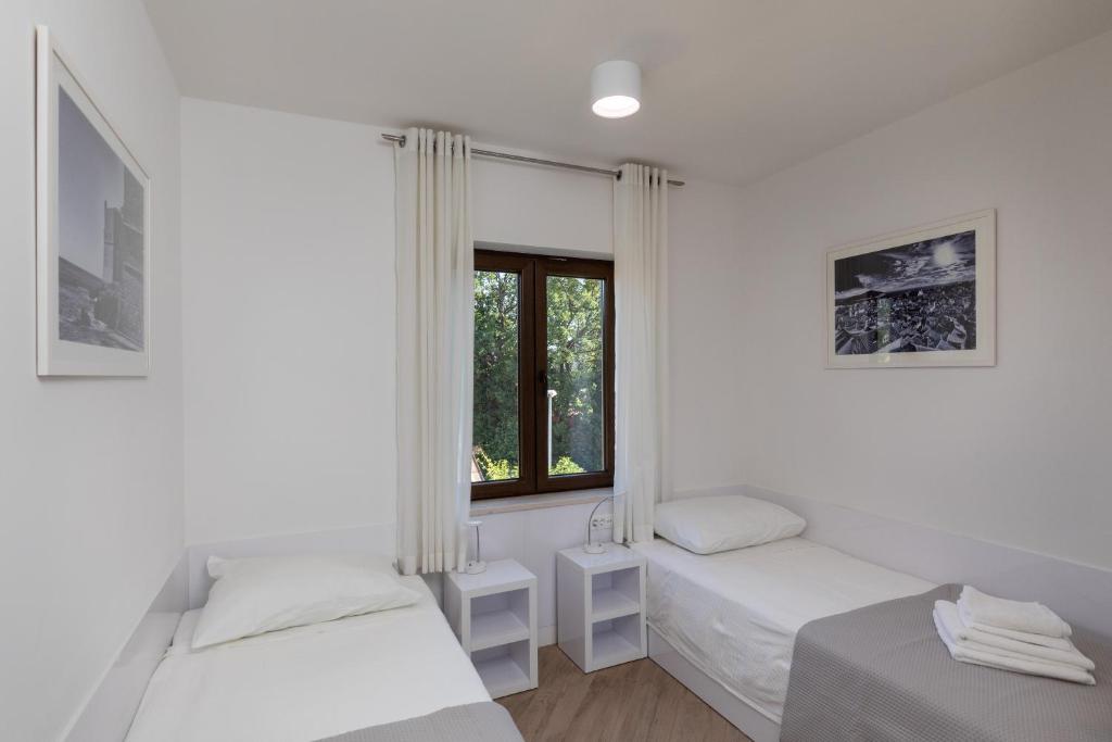 Posteľ alebo postele v izbe v ubytovaní Apartments Setemana