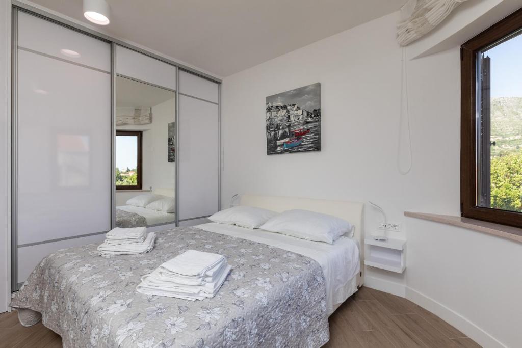 Posteľ alebo postele v izbe v ubytovaní Apartments Setemana