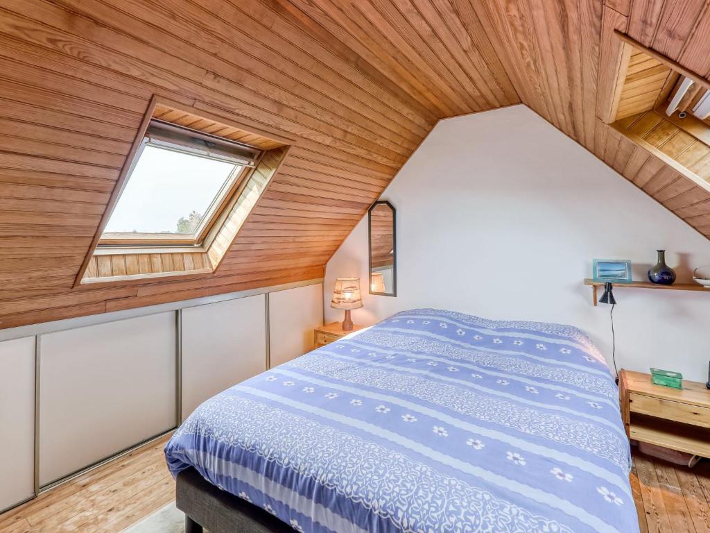 a bedroom with a bed and a window at Holiday Home Ker Kébec by Interhome in Crozon