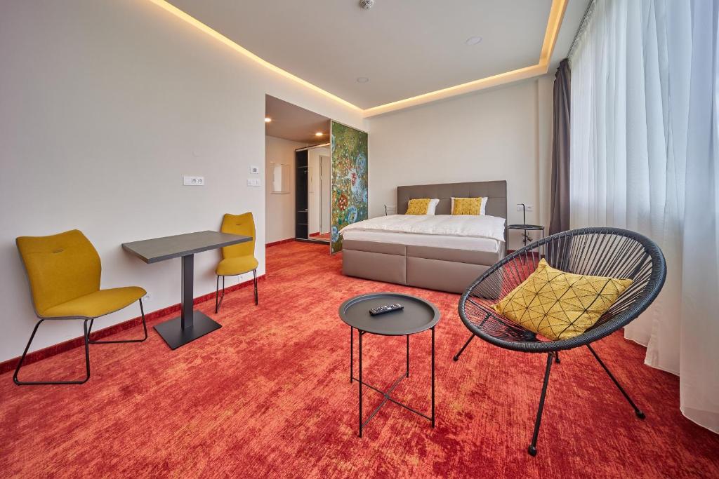 Postel nebo postele na pokoji v ubytování Hotel Hertz