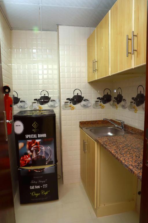 Kuchyň nebo kuchyňský kout v ubytování Onyx Hotel Apartments - MAHA HOSPITALITY GROUP