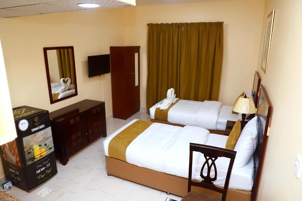 Postel nebo postele na pokoji v ubytování Onyx Hotel Apartments - MAHA HOSPITALITY GROUP