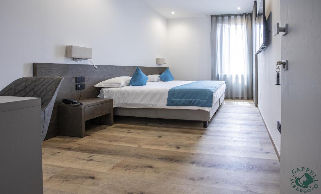 Voodi või voodid majutusasutuse Albergo Cappello e Cadore toas