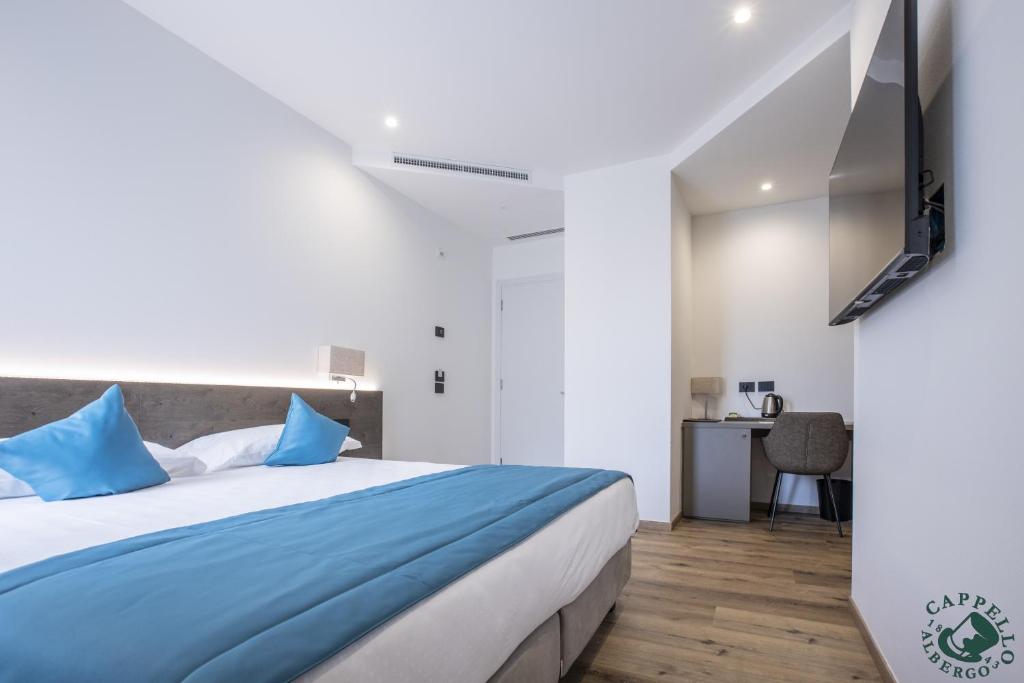 Voodi või voodid majutusasutuse Albergo Cappello e Cadore toas