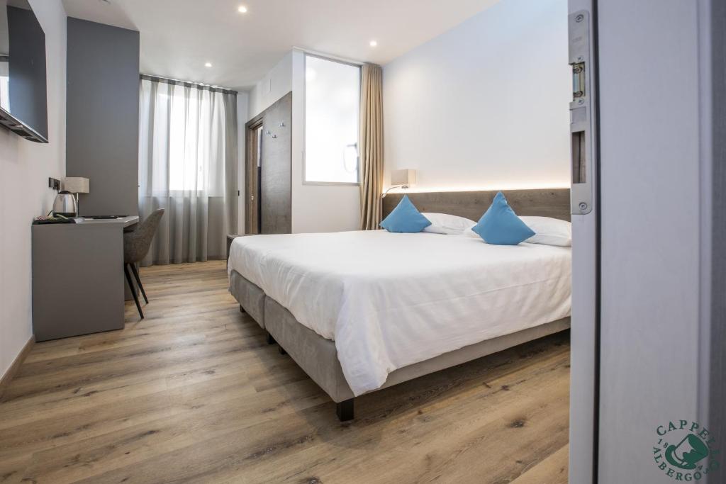 Voodi või voodid majutusasutuse Albergo Cappello e Cadore toas