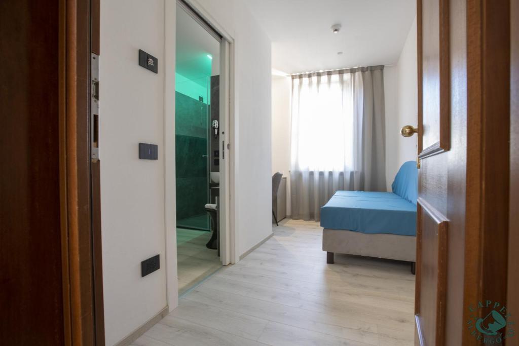 Voodi või voodid majutusasutuse Albergo Cappello e Cadore toas