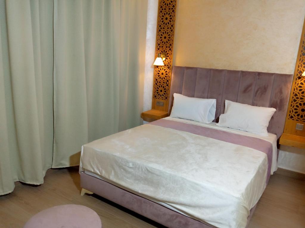 Postel nebo postele na pokoji v ubytování Palm’s Motel